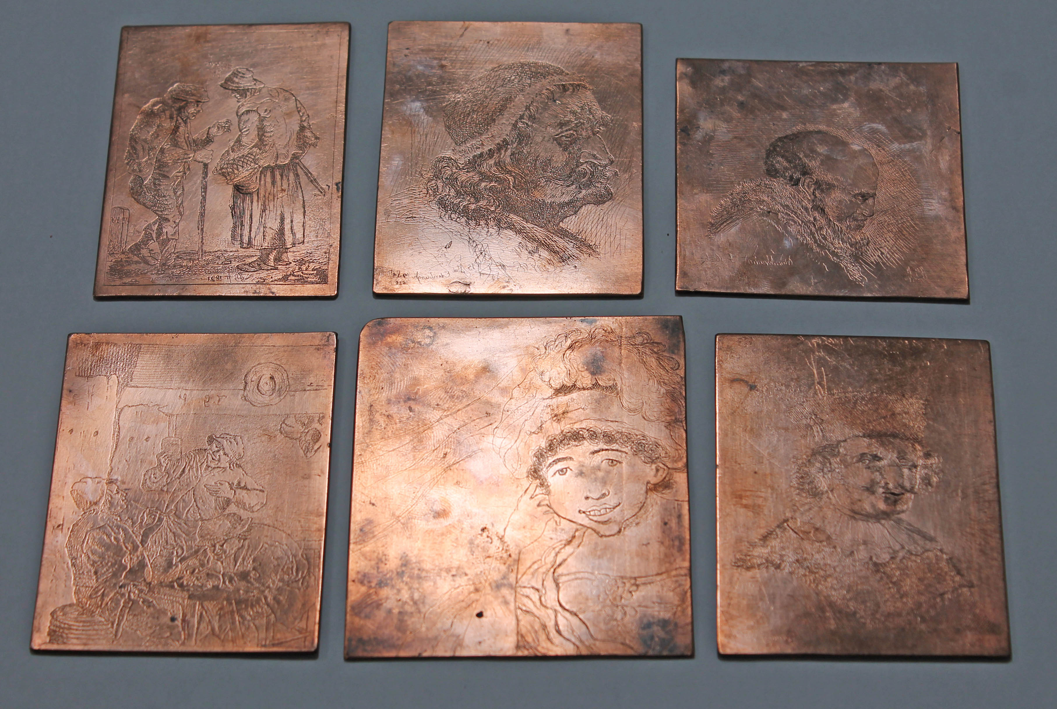 A group of six Victorian brass printing plates, largest 7.5cm x 9cm.