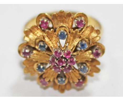 A sapphire and ruby ring marked '750', gross wt. 8.1g, size P.