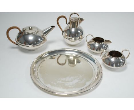 CHRISTOPHER DRESSER INSPIRED  ELECTROPLATE TEA SET OF THREE PIECES, circular and squat, the TEAPOT with rattan bound handle, 