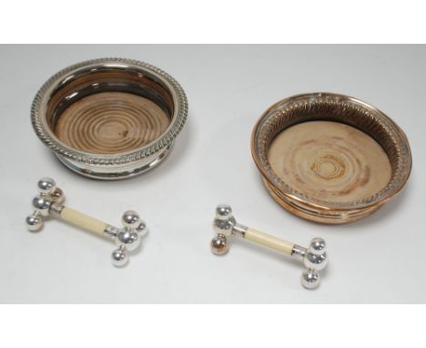 ELECTROPLATE WINE COASTER with applied gadroon edge, ANOTHER SIMILAR and a ELECTROPLATE AND BONE KNIFE RESTS with triple ball