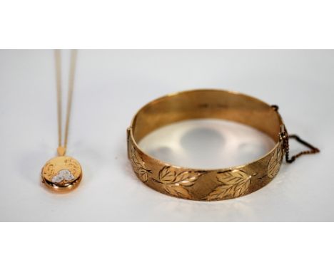 9ct GOLD MODERN ENGRAVED OVAL LOCKET AND FINE CHAIN NECKLACE, 3gms, in case and  SILVER GILT BROAD HINGE OPENING BANGLE,  the