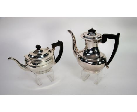 GEORGIAN STYLE SILVER TEAPOT, of stepped oval form with reeded rim, blackwood handle and finial, makers SB & S, Birmingham 19