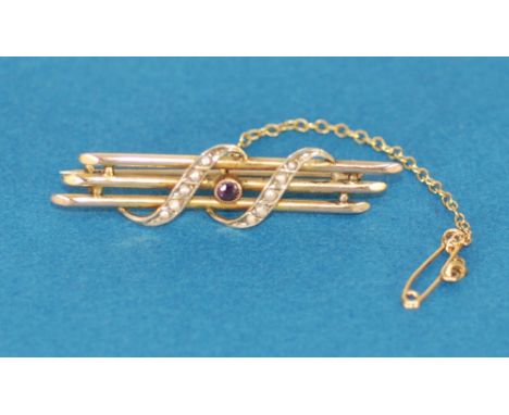 EDWARDIAN 9ct GOLD TRIPLE BAR BROOCH overlaid with two scrolls set with seed pearls and having centre small collet set amethy