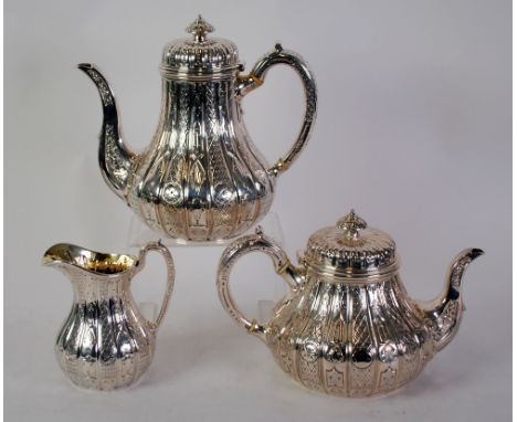 FINE VICTORIAN SILVER THREE PIECE TEA AND COFFEE SET by John Samuel Hunt, of pyriform with scroll heatproof  handles and dome