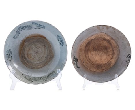 TWO CHINESE EXPORT BLUE AND WHITE CERAMIC DISHES
One decorated to the rim with stylised phoenixes and flowers; the other with