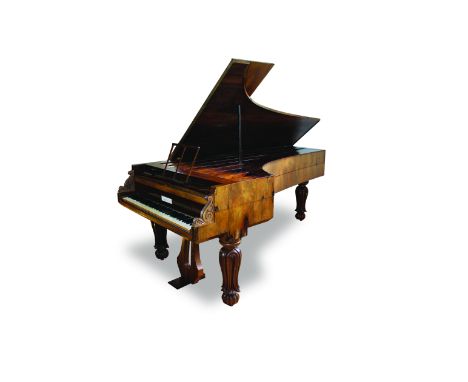 An 'Imperial Grand Piano by Robert Wornum, London, circa 1838 The rosewood case raised on three turned and carved legs. The u