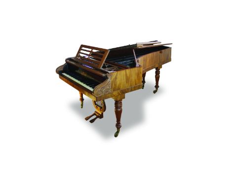 A grand piano by Broadwood, London, circa 1827 The figured mahogany case with cylinder front between carved bracket cheeks, r