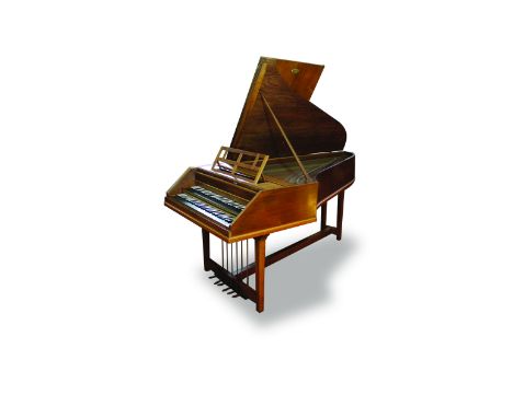 A double-manual harpsichord by Gaveau, Paris, 1912 The walnut case with three cast brass lid strap hinges and two pairs of fl