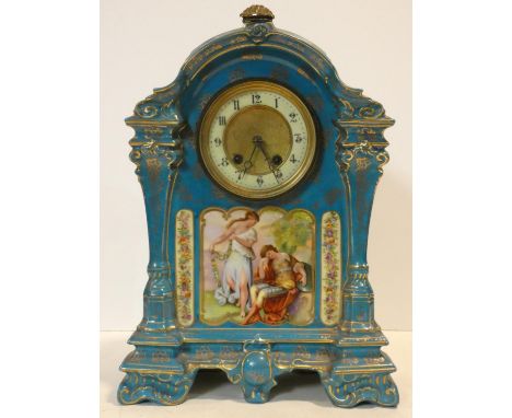 A 19th century ceramic cased mantel clock in pale blue glaze and gilt highlights, enamel and gilt metal face and with hand pa