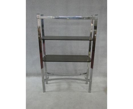 A vintage chrome and smoked glass two tier etagere. H.140xW.91xL.30cm 