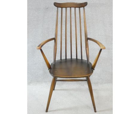 An Ercol Goldsmith Windsor armchair in elm and beech. H.96cm 