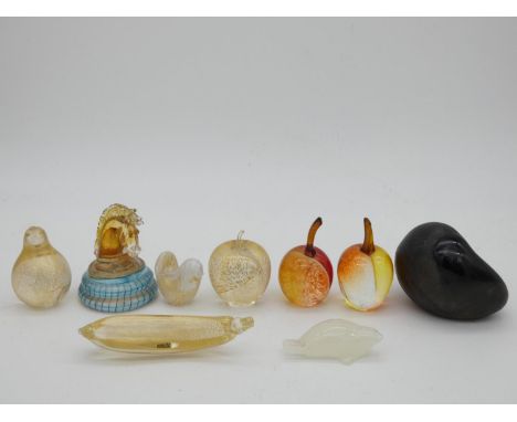 A collection of glass paperweights including Isle of Wight, Kosta Boda and a Haveland seal, a Murano Alfredo Barbini 'Scavo' 