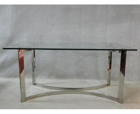 A vintage dining table in the style of Gavina, the heavy plate glass top resting on a shaped chrome base. H.76 W.159 D.90cm 