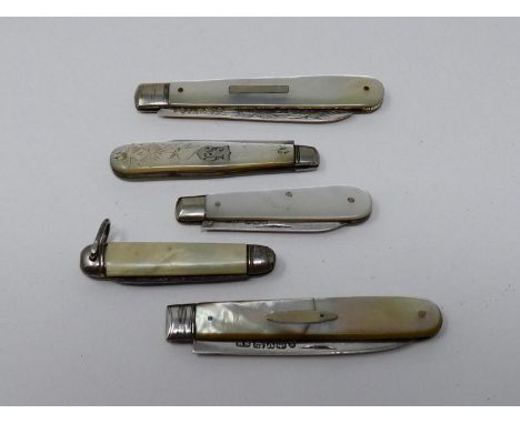 Four antique silver and mother of pearl fruit knives along with a vintage miniature celluloid pen knife. One with an engraved