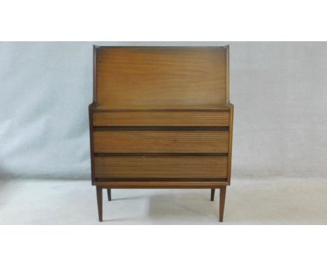 A Richard Hornby 1960's vintage afromosia bureau for Fyne Ladye Furniture with a fitted interior above three graduated reeded