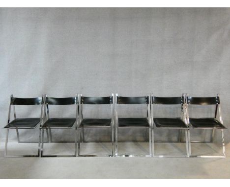 A set of six vintage Gavina style chrome framed folding dining chairs with stretched leather and sprung seats and backs. H.83