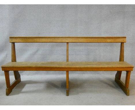 A vintage jointed oak hall seat on platform feet. H.82 W.183 D.50cm 