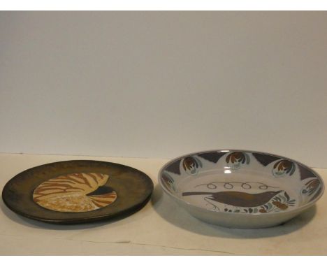 A charger with central nautilus decoration, signed R Mack and a Portuguese lustre glazed shallow bowl with flower and bird de