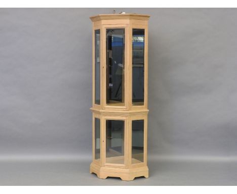 Light oak mirror backed corner display cabinet, which is lit from above, 182.5cm high