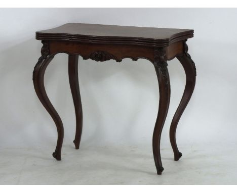 A 19th century continental flame mahogany fold over card table, the serpentine top enclosing baize interior on cabriole suppo