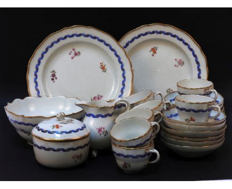 A Meissen tea set, comprising twelve cups and saucers, milk, sugar bowl and cover, and slops bowl, and two sandwich plates