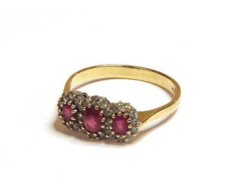 An 18ct gold ruby and diamond regal cluster ring