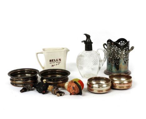 Two pairs of coasters, a bottle sleeve, decanter, water jug, and stoppers