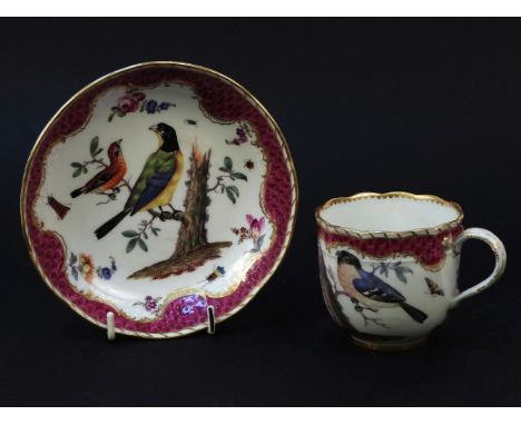 A Meissen cup and saucer, painted with birds on tree stumps, flowers and insects, gilt highlights and purple scale reserve, b