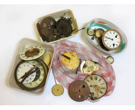 A box of clock movements, pendulums, etc