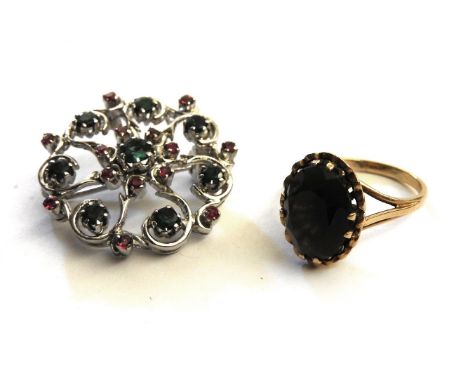 A 9ct gold single stone smokey quartz ring, and a emerald and ruby open work cluster brooch