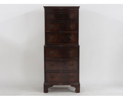 A mahogany bow fronted chest on chest of small size fitted six drawers on bracket feet, 55 x 40 x 132cm