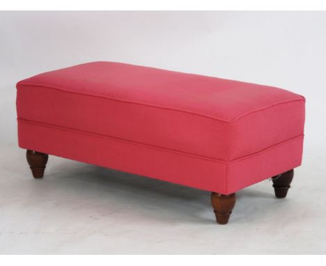 A contemporary pink upholstered pouffe, 54cm deep, 104cm long, 41cm high