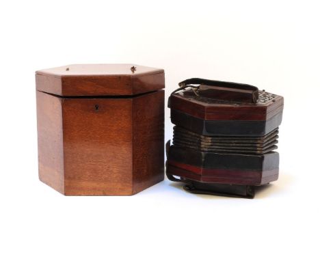 A Victorian twenty one button concertina by Lachenal, with green leather bellows and in original fitted case