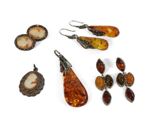 A silver curb link bracelet with silver padlock and crystal charm, a silver amber drop pendant, two pairs of amber earrings, 