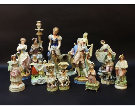 A large quantity of continental porcelain figures to include, a large figural candlestick, a pair of spill vases, etc (12)