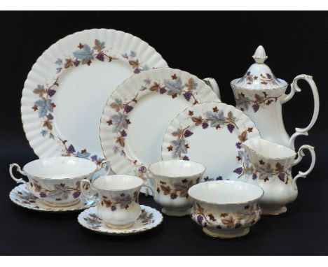 A Royal Albert 'Lorraine' pattern dinner and tea service, with grape and vine decorated border