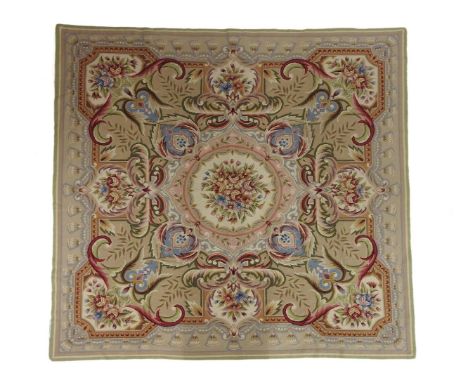 An Aubusson needlework carpet, centred with a floral roundel, cloth backed, 212 x 200 approximately