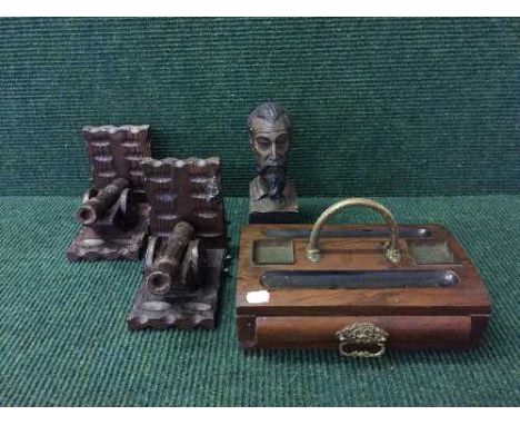 A pair of carved oak cannon bookends, carved bust of a man, Victorian mahogany inkstand etc