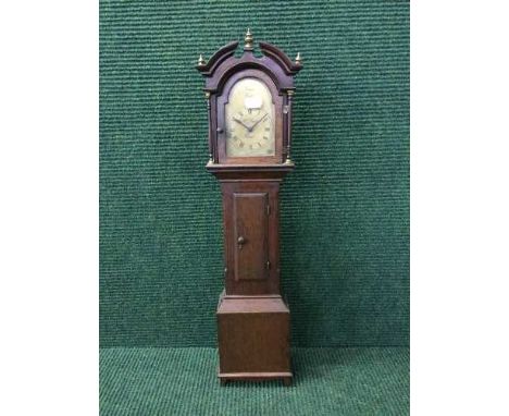 An early 20th century oak miniature longcase clock