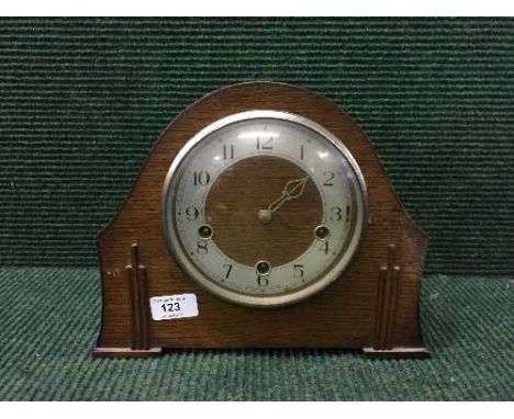 An oak cased mantel clock 