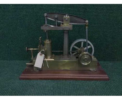 A scratch built brass live steam piston engine on plinth