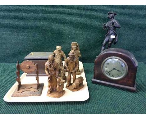 A tray of carved wood figures, oak mantel clock, trinket box, cast metal figure on stand etc
