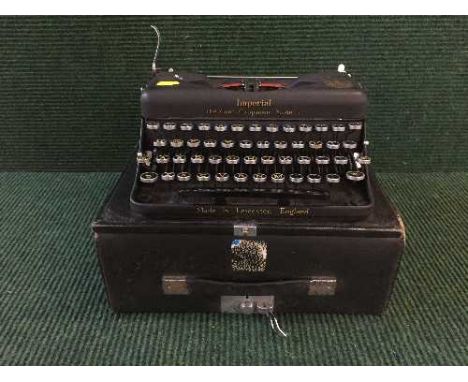 A cased vintage Imperial Model T typewriter