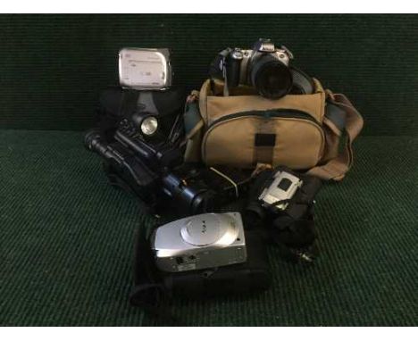 A box containing assorted cameras and camera equipment including Canon digital video camcorder, Nikon camera with lens etc