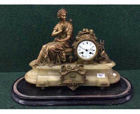 A Victorian gilt metal figural mantel clock on ebonised base