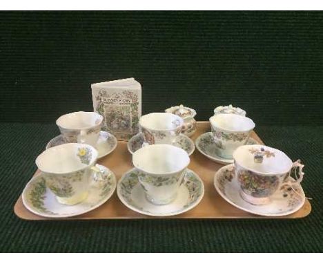 A tray of six Royal Doulton cups and saucers - seasons, two jam pots and a money box 