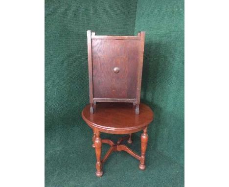 A circular stained oak occasional table and a stick stand 