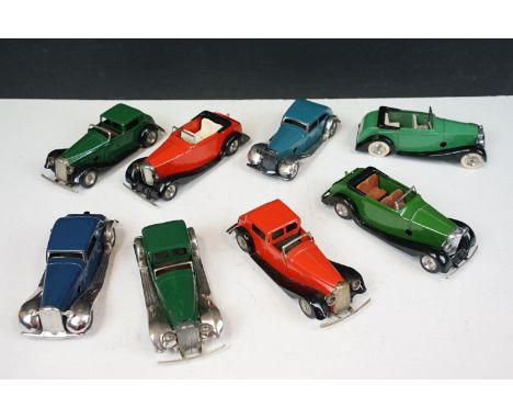 Eight Triang Minic clockwork tin plate models to include mainly saloon and open top type models in different colours featurin