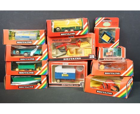 11 Boxed Britains farm model accessories to include 9577 Seed Drill, 9566 High Speed Tipper Cart, 9533 Low Loader, 9565 Tippi