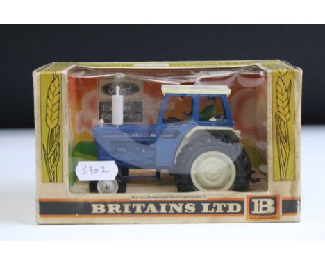 Boxed Britains 9524 Ford 6600 Tractor diecast model in blue, diecast ex, box grubby and a split to window 